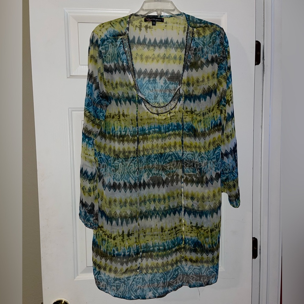 Gorgeous coverup with beautiful beading around neckline. One size fits most